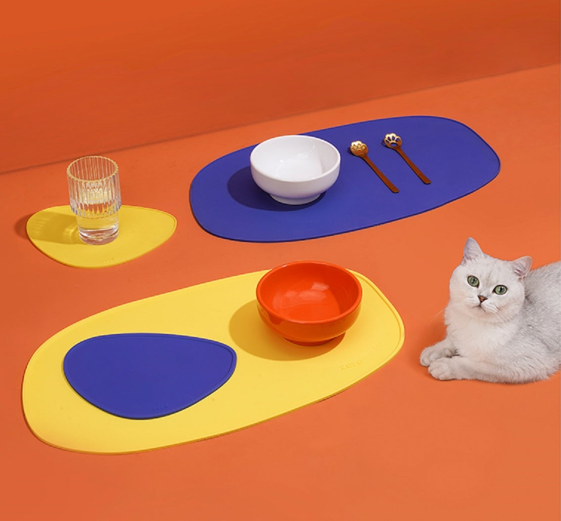 Colorful and unique pet dining mat with vibrant blue and yellow design, perfect for modern interiors. Stylish placemat keeps pet dining area clean and adds a playful touch to home decor.