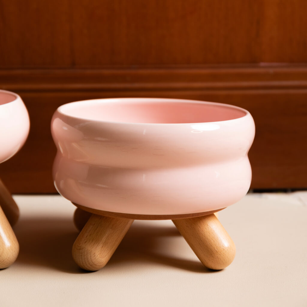 Close-up of Gulu Ceramic Pet Water Bowl's smooth cherry pink glaze finish.
