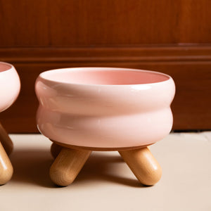 Close-up of Gulu Ceramic Pet Water Bowl's smooth cherry pink glaze finish.