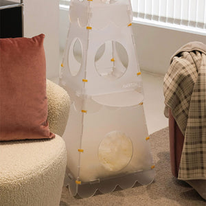 Lighthouse Cat Tower's bottom level offering a cozy pet cave with a plush mat for resting.