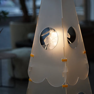 Close-up of the pinecone-shaped LED light on the Lighthouse Cat Tower, providing ambient lighting in a room.
