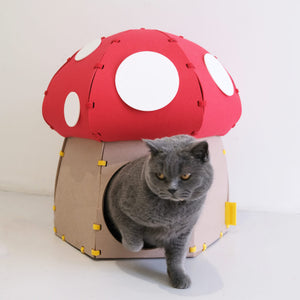 Close-up of a cat exiting the Mushroom Felt Cat Cave, demonstrating its durability and secure structure.