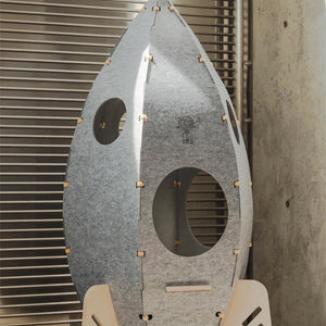 Rocket Cat Tower with concealed cat door and minimalist style in modern home.