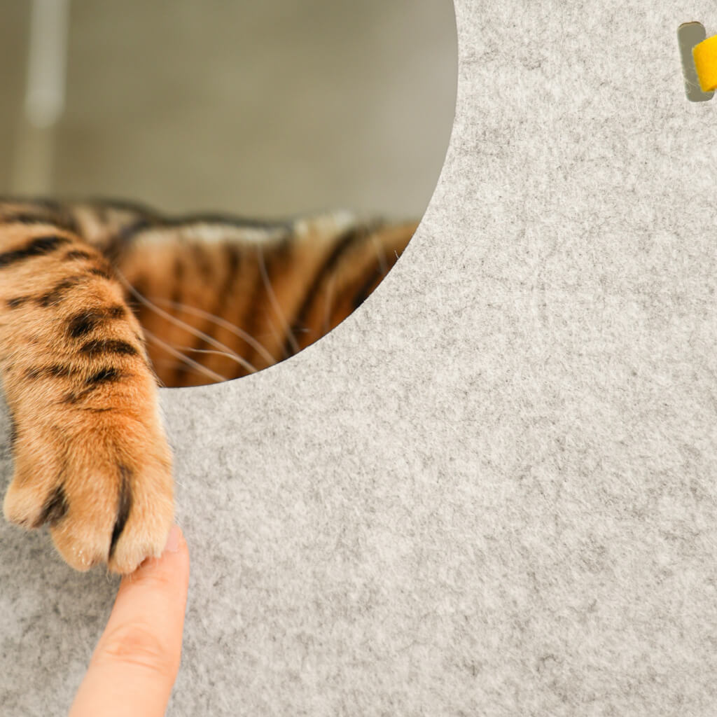 Artistic close-up of the Rocket Cat Tower's felt design in a contemporary setting.