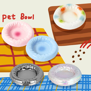 Colorful Pet Bowls Displayed on a Plaid Tablecloth – Showcasing a range of buoy-inspired pet bowls in pastel pink, baby blue, tie-dye, metallic silver, and iridescent pearl finishes, perfect for both pets and home decor.