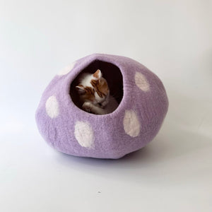 Cat napping inside the Taro Purple Wool Felt Cat Cave – handmade cozy hideout