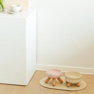 Cherry Pink ceramic pet bowls with wooden legs in modern home setting.