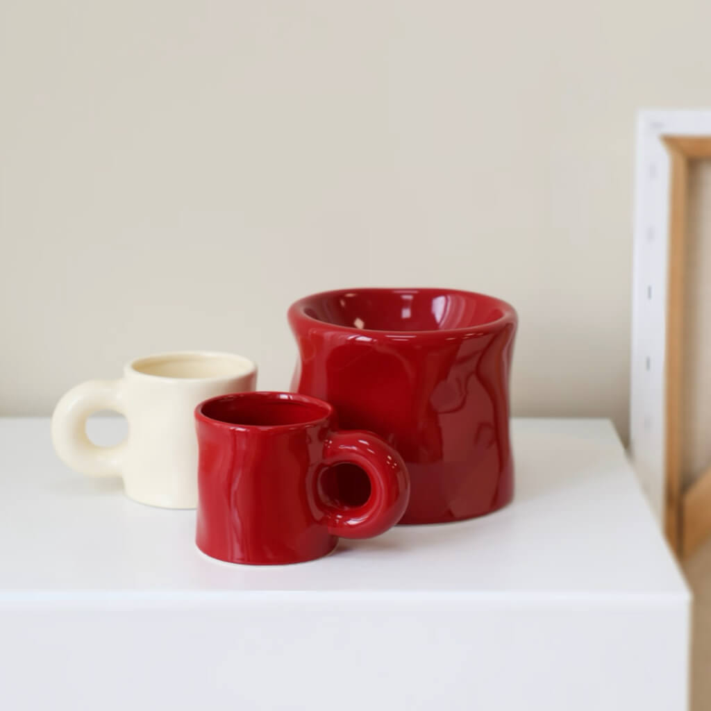 Pinch Ceramic Mug & Elevated Pet Bowl Set in Bordeaux Red, displayed with a matching cream ceramic mug. Minimalist design with bold color accents, perfect for pet dining and morning coffee.
