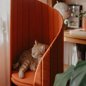 Close-up of the Time Travel Tower Cat Tree in Red, showcasing its sleek design and comfortable perch for cats to rest and play.