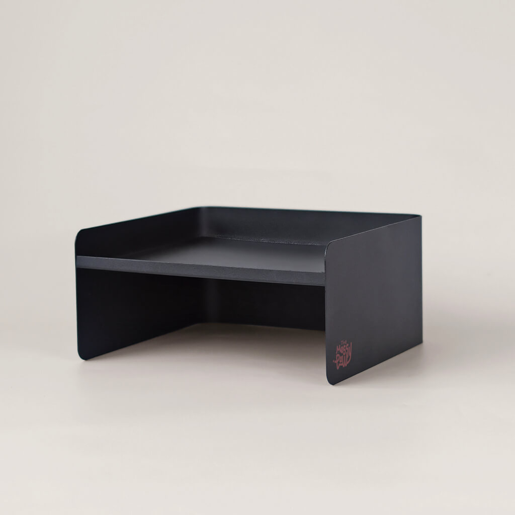 Black metal pet bowl stand with minimalist dual-height design – elevated feeding base for cats and small dogs.