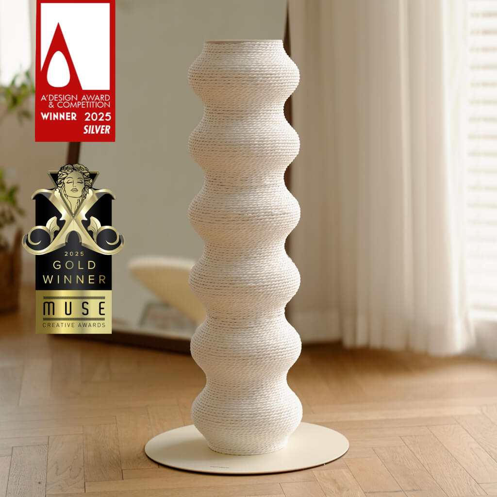 White sculptural Coral Scratcher for cats, featuring a wavy minimalist design. Momoland’s award-winning cat scratching post – 2025 MUSE Gold and A'Design Silver winner.