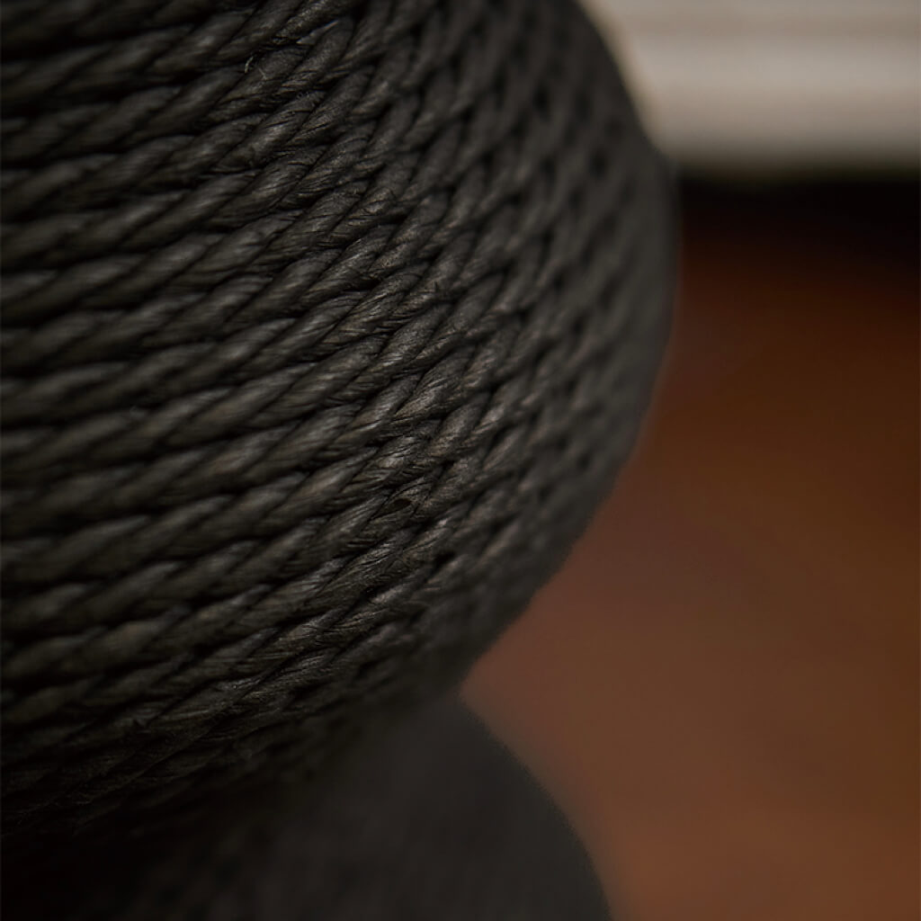 Close-up of black paper vine rope texture on the Minimalist Wavy Scratching Post replacement part. Durable and cat-friendly scratching material.