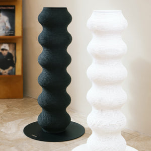 Black and white Wavy Scratching Posts complementing a modern living room decor.