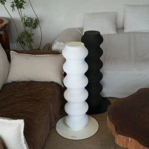 Cat scratching the Minimalist Wavy Scratching Post, showing its durable and cat-friendly design.