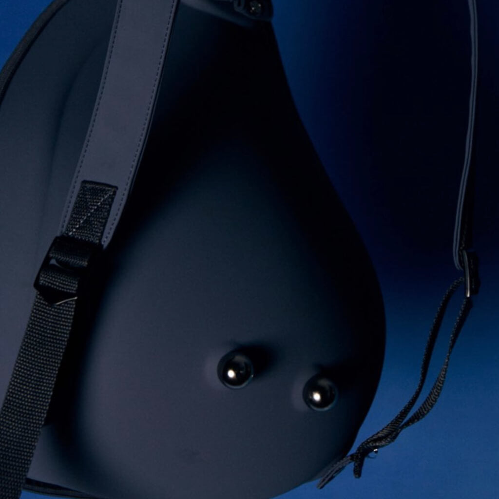  Close-up of the backpack’s adjustable straps and base, focusing on durability and construction details.