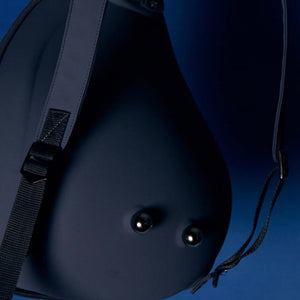  Close-up of the backpack’s adjustable straps and base, focusing on durability and construction details.