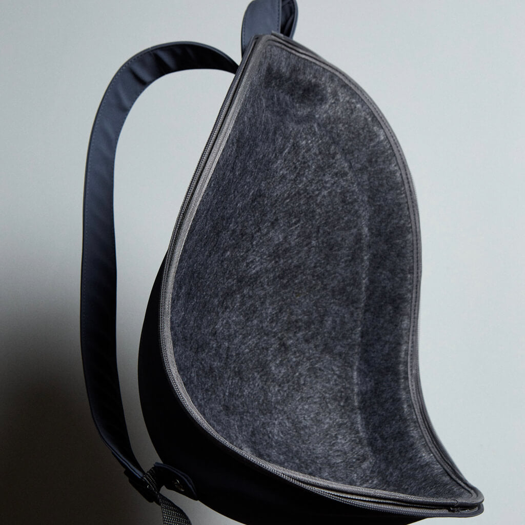 Extra-light Cat Travel Backpack - minimalist, stylish design against a blue sky background.