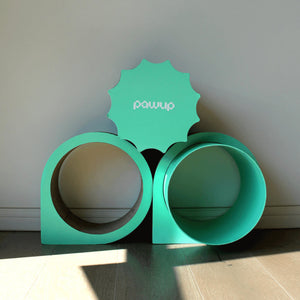 Close-up of the green XYZ Modular Cat Scratcher with curved design for scratching and lounging.