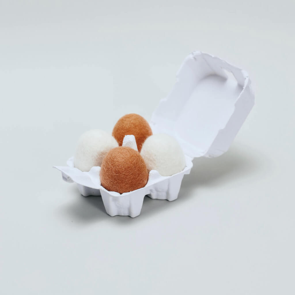Carton of four wool felt eggs from the Baguette & Eggs Felt Cat Toys Set.