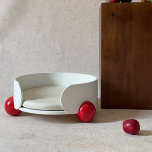 White HugMe Pine Wood Pet Lounger with red ball accents – A minimalist and modern cat bed designed for luxury comfort and interior harmony.