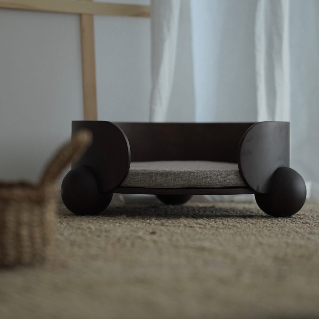 HugMe Pet Lounger from a front angle, showing curved wraparound design – The semi-enclosed structure mimics a comforting embrace for anxious pets.