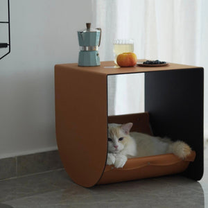 Multi-functional cat cave and side table in premium saddle leather, designed for modern home decor and cozy feline relaxation.