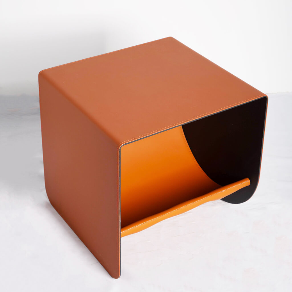 Premium saddle leather pet furniture featuring a curved hammock design, giving cats a comfortable lounging space.