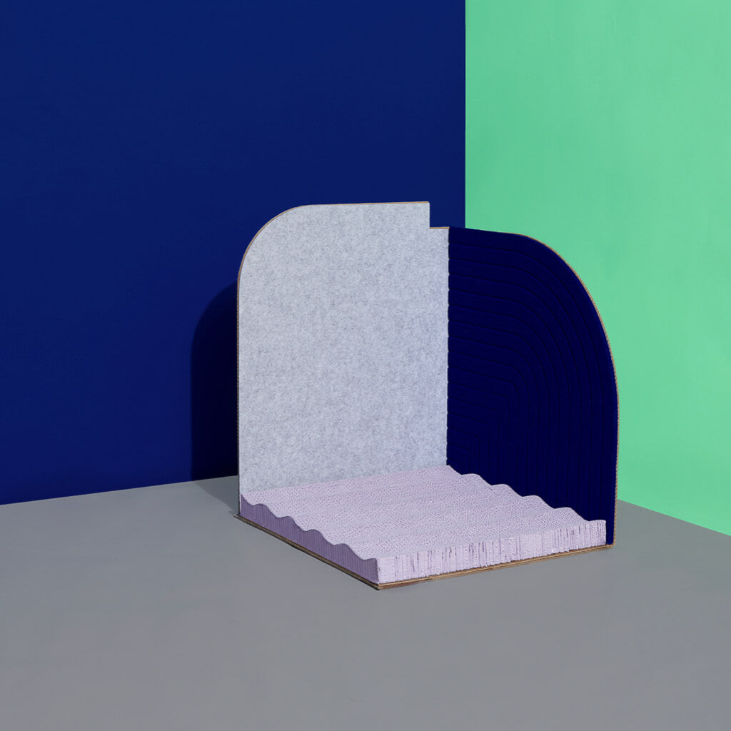Minimalist Cat Scratcher Design: A corner placement of the minimalist Purrre 3-Dimensional Design Cat Scratcher in Velvet Blue, blending seamlessly with modern home decor.