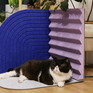 Black and white cat relaxing by Scratcher: Black and white cat lounging by the Purrre 3-Dimensional Design Cat Scratcher in Velvet Blue, demonstrating its comfort and versatility for resting or play.