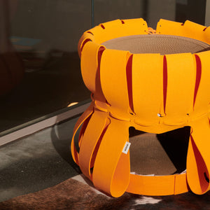 Volcano Orange Cat Den with bright natural light, showing durable honeycomb design.