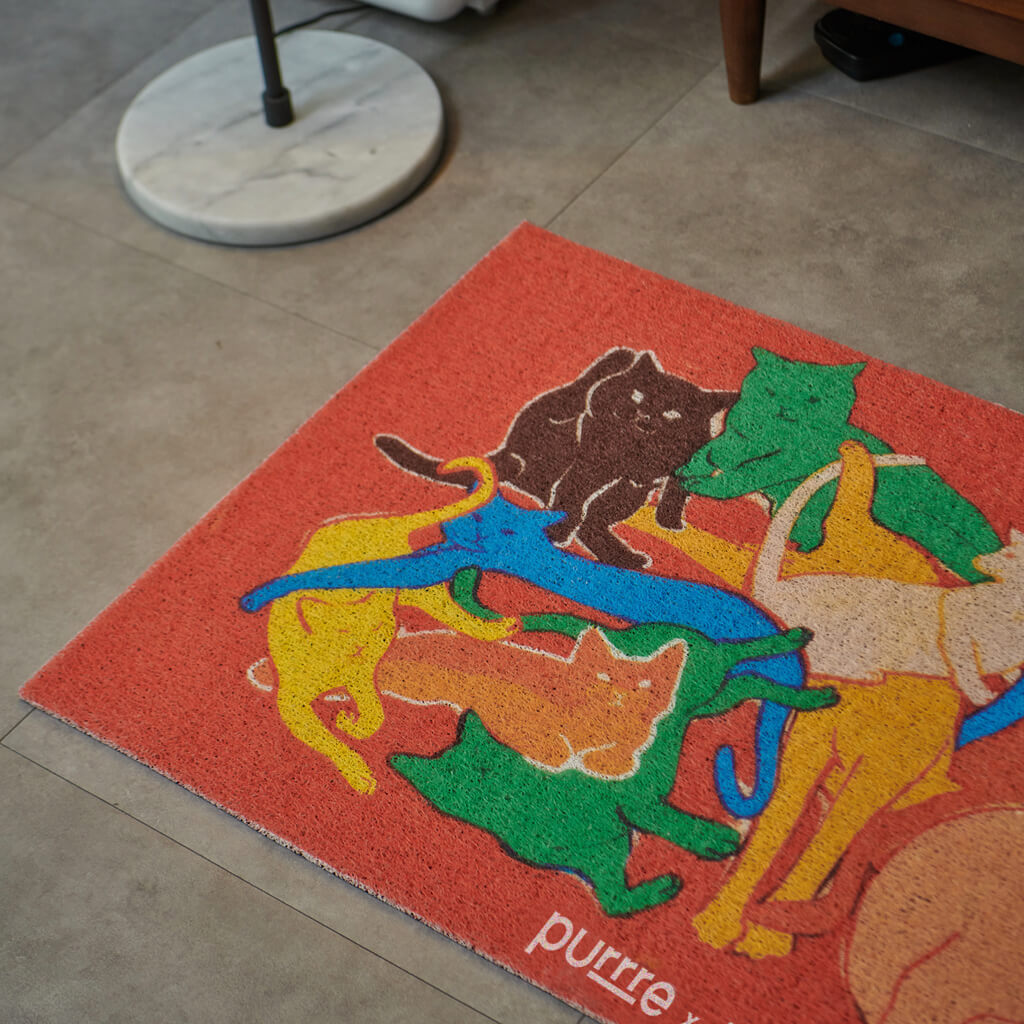 Close-up of the Purrre Cat Illustration Floormat displaying the bright, colorful cat illustrations.