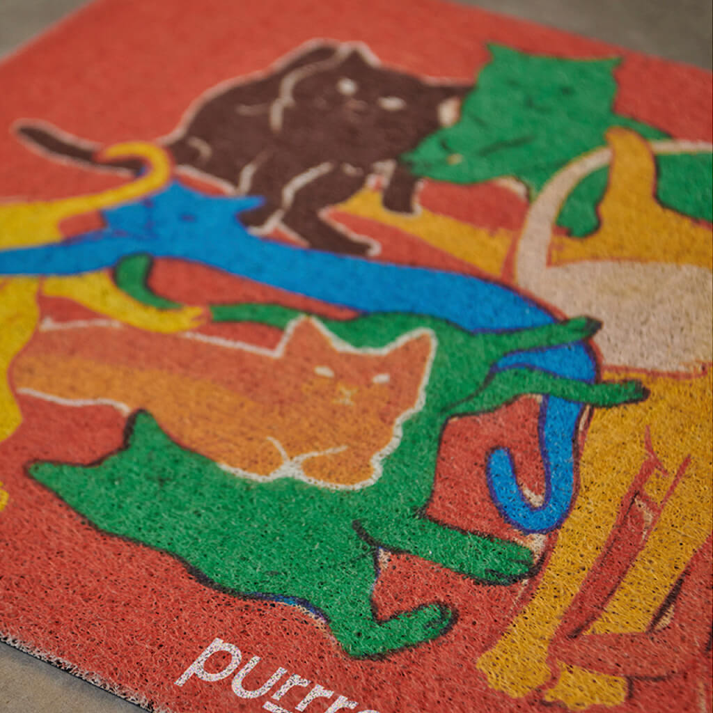 Close-up of the Purrre Cat Illustration Floormat displaying the bright, colorful cat illustrations.