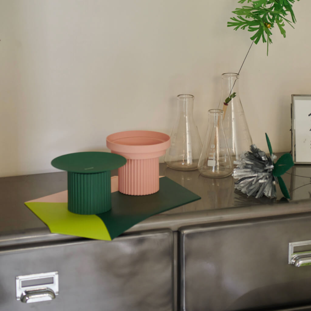 Coral and green Purrre Teeth Party Pet Bowls arranged on a designer surface, blending seamlessly with home decor.