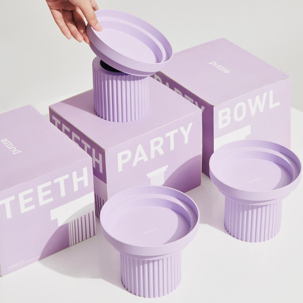 purrre Teeth Party Pet Bowl - Pale Purple Packaging Display - Pale purple pet bowls with matching packaging boxes, displayed elegantly.