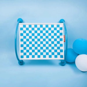 Blue cat hammock showcasing its checkerboard design and sturdy blue frame in a playful environment.