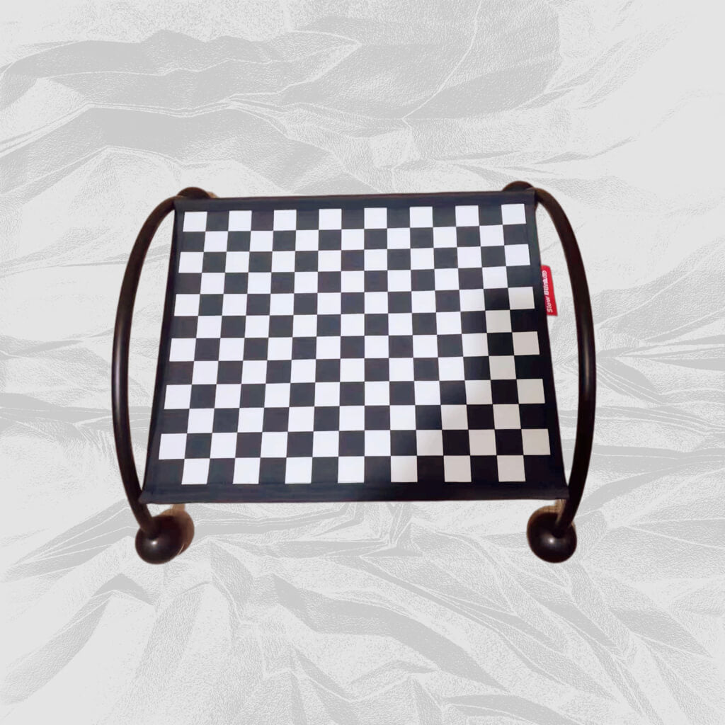 Elevated black cat hammock with a classic checkerboard design on a textured gray background.