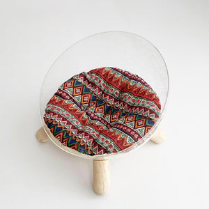 Clear bowl-shaped cat bed with bold red geometric cotton-linen cushion – Bohemian style