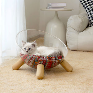 Top view of red patterned pet cushion in transparent acrylic Moonlight Nest cat lounger