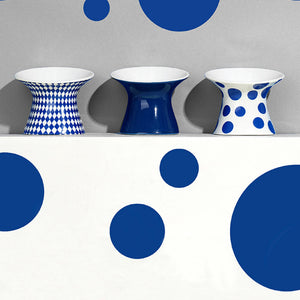 Blue Polka Dot Elevated Ceramic Pet Bowl displayed with modern home decor elements.