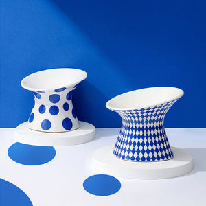 ZEZE Elevated Ceramic Bowl in Blue Rhombus and Blue Polka Dots designs on display.