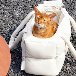 Stylish and comfortable quilted puffer tote bag for pets, designed for easy carrying and cozy pet naps.