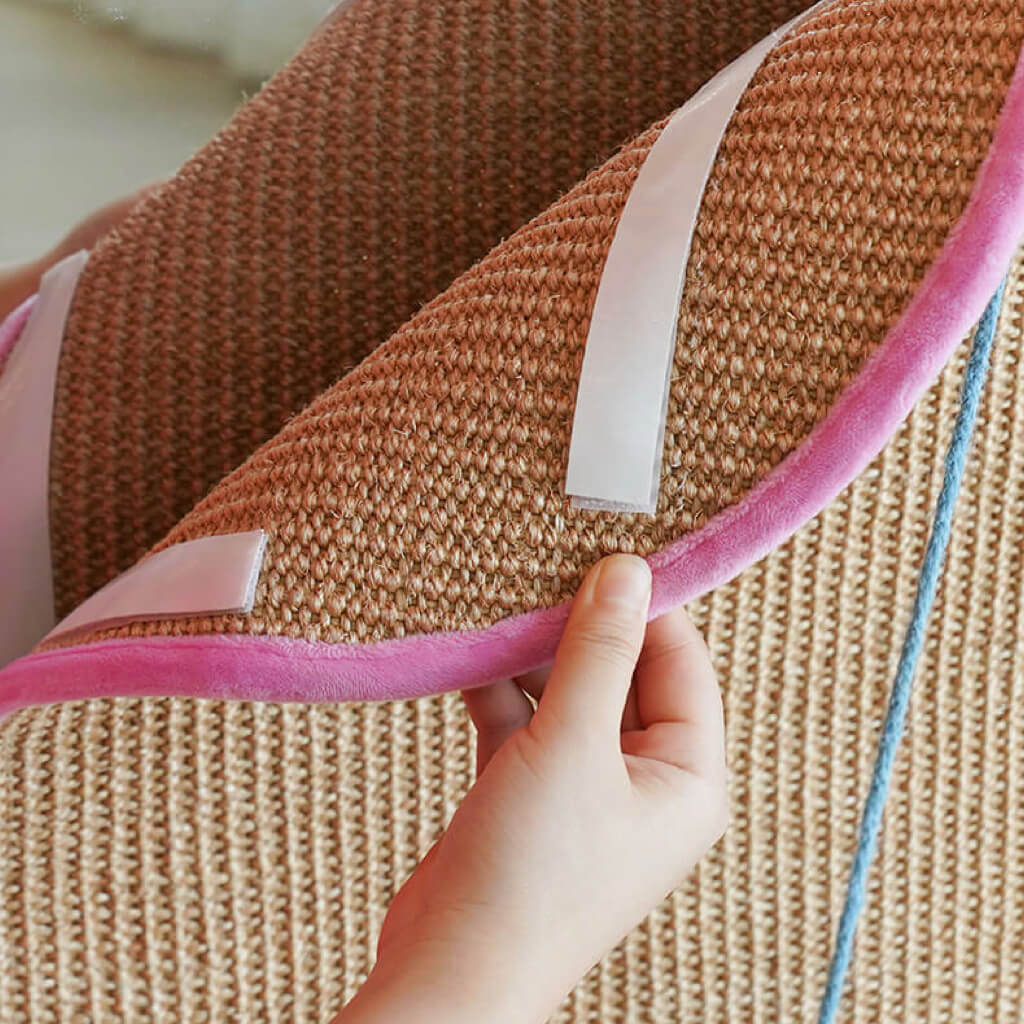 Close-up of the durable natural hemp material and double-sided tape on Dopamine-Style Cat Sisal Scratching Mat, demonstrating its ability to securely stick to walls for versatile placement.