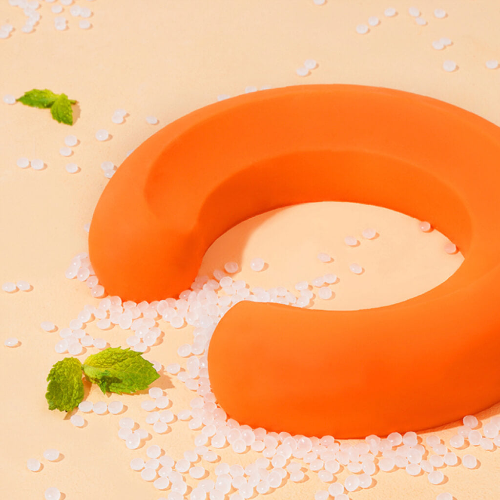 Close-up of orange food-grade silicone base for Zeze glazed ceramic pet bowl.