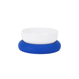 Minimalist white ceramic pet bowl with blue silicone base, perfect for pet dining.