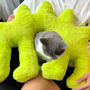 Fluo Green Boom Boom Cat Cushion with a cat sitting inside the pillow.