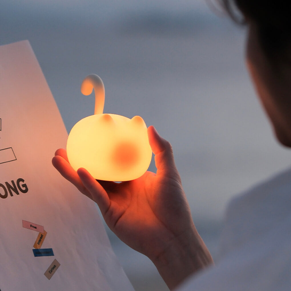 Cat Silhouette Tap Night Light – dual-brightness, cordless and USB-C rechargeable; warm glow held in hand for bedside reading.