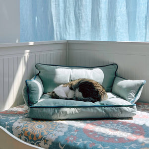 Cozy Pet Sofa Bed - Piped #23 Zweig with a cat curled up, showcasing soft canvas material.