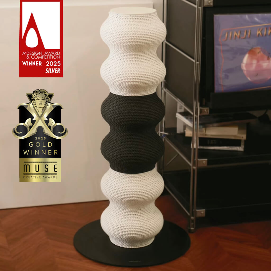 Coral Cat Scratcher — bicolor black & white wavy cat scratching post with award badges, modern living room.