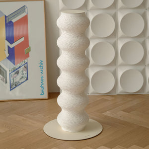Momoland Coral Scratcher – White wavy vertical cat scratching post on round base; contemporary designer cat furniture styled in a minimalist home interior.