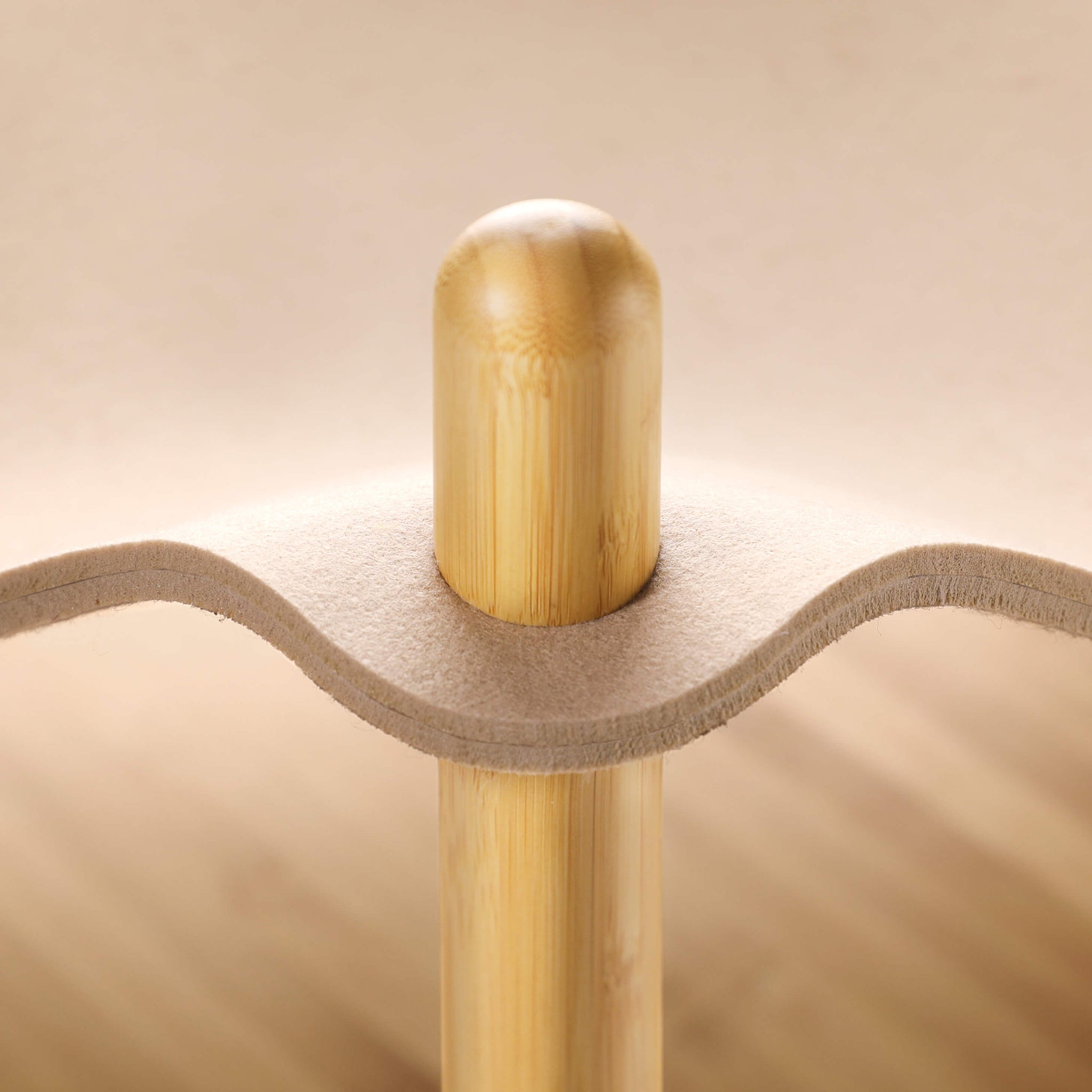 Close-up of the bamboo and felt structure showing the smooth connection between the bamboo post and the soft felt in the Smelling Felt Cat Bed.
